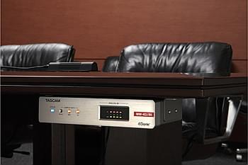 Unit mounted under a desk using included brackets | Tascam Dante Compact Processor Series